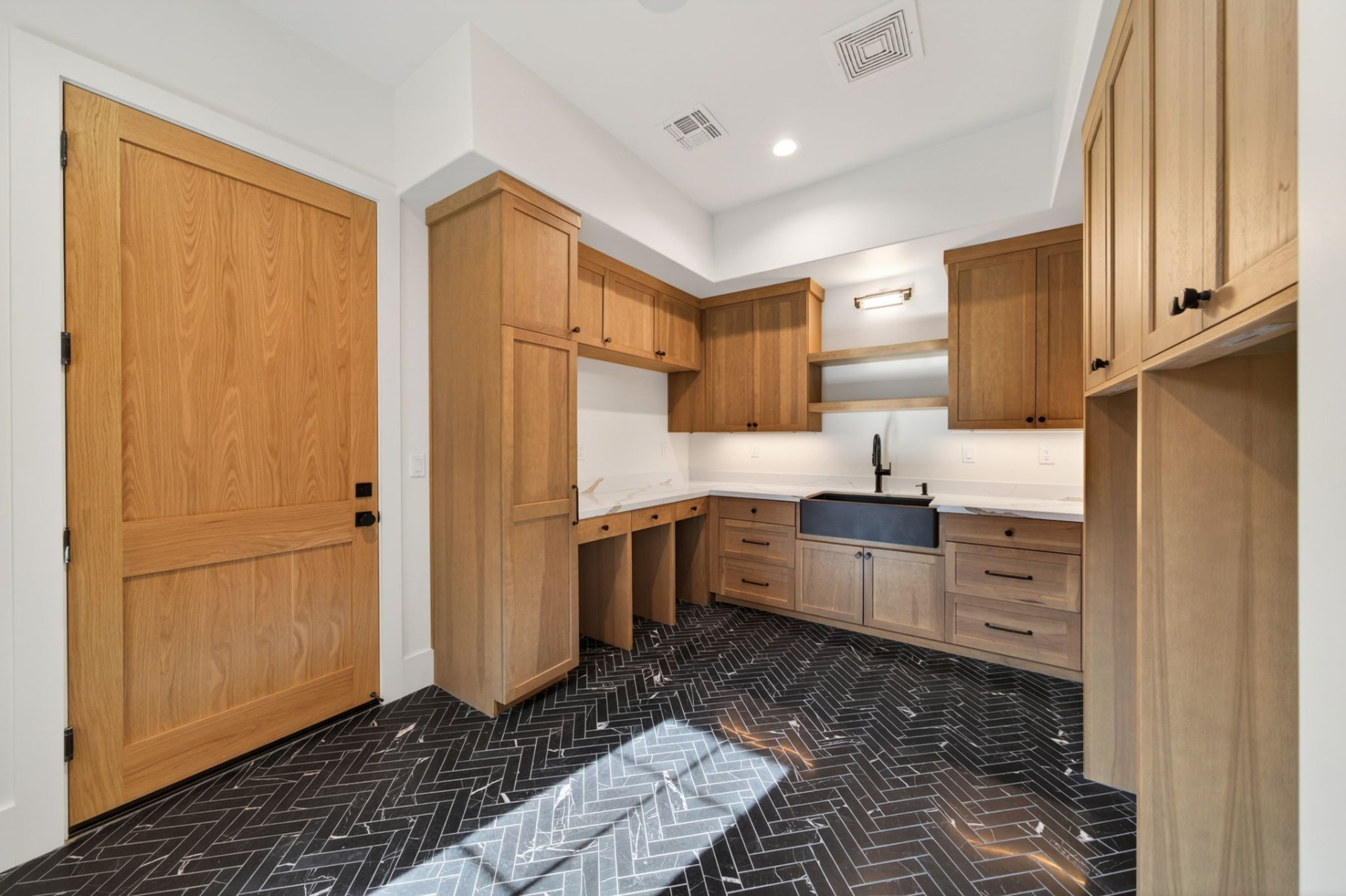 Prep kitchen and butler's pantry with herringbone tile