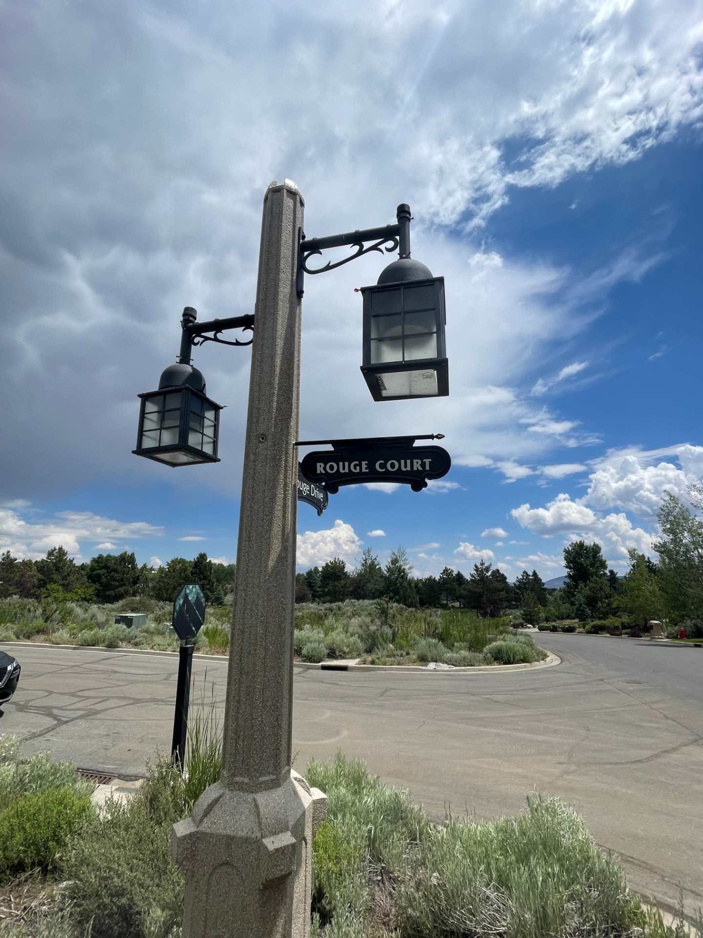 Rouge Court street sign with lantern posts at the entrance to the Montreux neighborhood